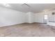 Bedroom featuring neutral carpeting, a closet for storage, and exterior access at 1511 E 20Th St, Muncie, IN 47302