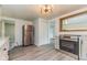 Kitchen featuring stainless steel refrigerator and oven with modern grey cabinets and flooring at 1511 E 20Th St, Muncie, IN 47302