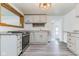 Functional kitchen with white cabinets, neutral countertops, and modern appliances at 1511 E 20Th St, Muncie, IN 47302