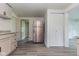 A kitchen with stainless steel refrigerator, grey cabinets, modern flooring and a closet at 1511 E 20Th St, Muncie, IN 47302