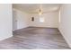 Bright living room featuring modern gray wood flooring, neutral paint and natural light from the window at 1511 E 20Th St, Muncie, IN 47302