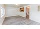 Bright living room featuring neutral paint, modern vinyl floors, and lots of natural light at 1511 E 20Th St, Muncie, IN 47302