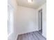 Cozy bonus room featuring gray vinyl flooring, neutral paint and a well-lit interior at 1511 E 20Th St, Muncie, IN 47302