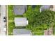 Birds-eye view of the property, highlighting its layout and surrounding greenery at 1550 Hoefgen St, Indianapolis, IN 46203