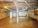 Unfinished basement featuring concrete foundation, exposed duct work, and water heater at 1550 Hoefgen St, Indianapolis, IN 46203