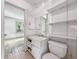 Bathroom featuring a toilet, vanity with storage, and open shelving at 1550 Hoefgen St, Indianapolis, IN 46203