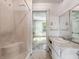Bathroom featuring a tub/shower combo, vanity with storage, and a large mirror at 1550 Hoefgen St, Indianapolis, IN 46203