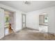 Bedroom with archway and views into the bathroom, and light from the window at 1550 Hoefgen St, Indianapolis, IN 46203