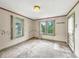 Inviting bedroom with natural light, and door to outside at 1550 Hoefgen St, Indianapolis, IN 46203