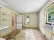 Bedroom featuring a light-filled window and original wood flooring at 1550 Hoefgen St, Indianapolis, IN 46203