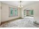 Dining room with natural light from the window and views through the archway to other rooms at 1550 Hoefgen St, Indianapolis, IN 46203
