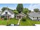 Charming single-story home with a cozy front porch and mature trees in a residential neighborhood at 1550 Hoefgen St, Indianapolis, IN 46203