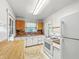 Functional kitchen includes a gas range, refrigerator and cabinetry at 1550 Hoefgen St, Indianapolis, IN 46203
