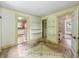 Living area with natural light, convenient shelving, and easy access to kitchen at 1550 Hoefgen St, Indianapolis, IN 46203