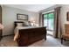 Comfortable bedroom with natural light, neutral color scheme and a decorative wrought iron bedframe at 160 Scranton Ct, Zionsville, IN 46077