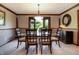 Dining room featuring a modern glass table and bay window that provides ample natural light, with light grey walls at 160 Scranton Ct, Zionsville, IN 46077