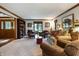 Bright living room boasts stylish decor, large windows, and an inviting sitting area at 160 Scranton Ct, Zionsville, IN 46077