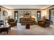 Comfortable living room featuring neutral carpet, sofa, armchairs, and a serene atmosphere at 160 Scranton Ct, Zionsville, IN 46077