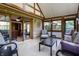 An inviting sun room featuring a neutral color palette and light hardwood flooring, with a view of the outdoors at 160 Scranton Ct, Zionsville, IN 46077