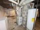 Unfinished basement with water heater and furnace at 1601 E 44Th St, Indianapolis, IN 46205