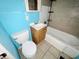 Tiled bathroom featuring a sink, toilet, and tub, ready for remodeling and a fresh design at 1601 E 44Th St, Indianapolis, IN 46205