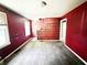 Spacious living room with outdated red and gold wallpaper at 1601 E 44Th St, Indianapolis, IN 46205