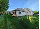 Well-maintained backyard with manicured lawn and landscaped garden beds, perfect for outdoor enjoyment at 16254 Quartz Dr, Noblesville, IN 46060