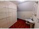 Attic bathroom with open storage shelving and laminate flooring, maximizes space at 16254 Quartz Dr, Noblesville, IN 46060