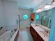 Well-lit bathroom with double sinks, a soaking tub, and a separate shower area at 16254 Quartz Dr, Noblesville, IN 46060