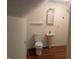 Compact bathroom with pedestal sink, toilet, and mirrored cabinet, designed for efficiency at 16254 Quartz Dr, Noblesville, IN 46060