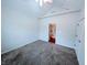 This carpeted bedroom has a double door closet, and a view into the next room at 16254 Quartz Dr, Noblesville, IN 46060