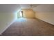 Large, carpeted bonus room with dormer windows and ceiling fan offers flexible living space at 16254 Quartz Dr, Noblesville, IN 46060