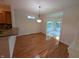 Dining area with hardwood floors, natural light, and a view of the surrounding living areas at 16254 Quartz Dr, Noblesville, IN 46060