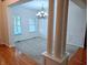 Spacious dining area with decorative columns, elegant lighting, and ample natural light at 16254 Quartz Dr, Noblesville, IN 46060