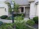 Inviting front porch with detailed brickwork, lovely landscaping, and a charming entrance at 16254 Quartz Dr, Noblesville, IN 46060
