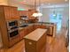 Open kitchen with wooden cabinets, stainless appliances, and a center island, great for cooking at 16254 Quartz Dr, Noblesville, IN 46060