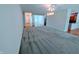 Spacious room with gray carpet, offering versatile design options for living and entertainment at 16254 Quartz Dr, Noblesville, IN 46060