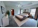 Well-appointed main bedroom with a tray ceiling, natural light, and plenty of space at 16254 Quartz Dr, Noblesville, IN 46060