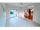 Light-filled sunroom with tile flooring, sliding glass doors, and easy access to the dining and kitchen areas at 16254 Quartz Dr, Noblesville, IN 46060