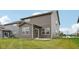 The backyard features green grass and a view of the home's gray siding and neutral trim at 1911 Goodwin Pl, Westfield, IN 46074