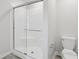 Bathroom with glass-enclosed shower and toilet at 1911 Goodwin Pl, Westfield, IN 46074