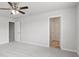Spacious bedroom with ceiling fan, carpet, and two doorways at 1911 Goodwin Pl, Westfield, IN 46074