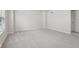 Spacious bedroom with neutral carpet, large window, and white trim at 1911 Goodwin Pl, Westfield, IN 46074