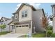 Two-story home with brown and beige siding, an attached two car garage and green grass at 1911 Goodwin Pl, Westfield, IN 46074