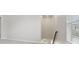Bright hallway with stairway and window to the right at 1911 Goodwin Pl, Westfield, IN 46074