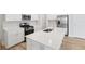Bright kitchen with white cabinets, stainless steel appliances, and island with sink and bar seating at 1911 Goodwin Pl, Westfield, IN 46074