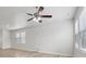 Spacious living room with wood-look flooring, ceiling fan, and natural light at 1911 Goodwin Pl, Westfield, IN 46074