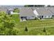 Aerial view of a backyard and patio with green lawn surrounded by neighboring houses in a residential area at 19959 Cowie Ln, Westfield, IN 46074