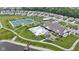 A beautiful aerial view showcases the community pool, tennis courts, clubhouse, and walking trails at 19959 Cowie Ln, Westfield, IN 46074