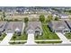 A high aerial view shows a neighborhood with well-manicured lawns and new homes at 19959 Cowie Ln, Westfield, IN 46074